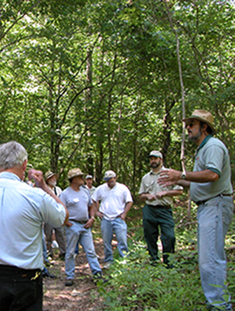 man giving lecture outdoors